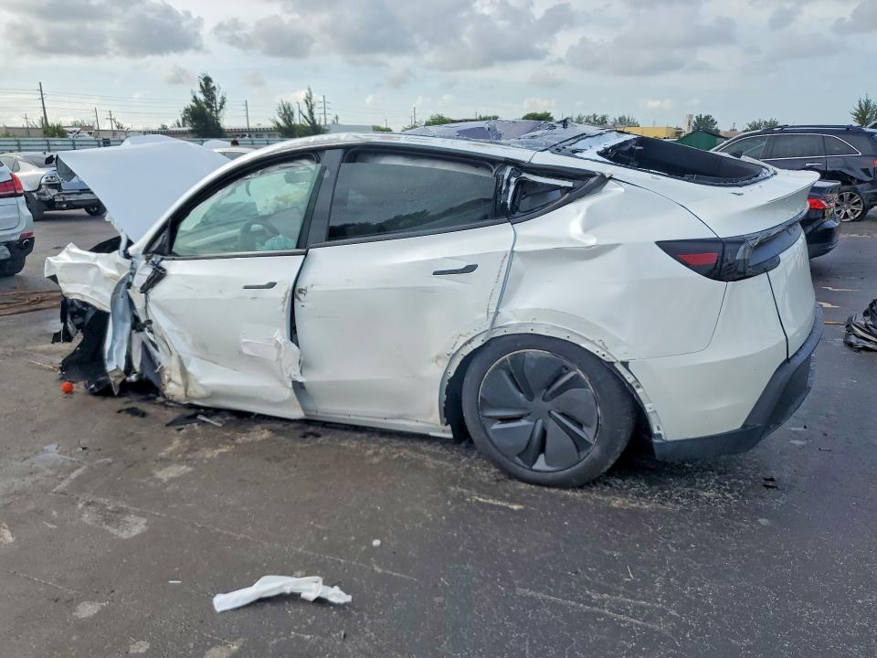 2026 Tesla Model y VIN 7SAYGDED6TA644142 COPART salvage auction — ALL OVER, Fl - Certificate Of Destruction, sold $300 on 2026-07-27 (photo 2)