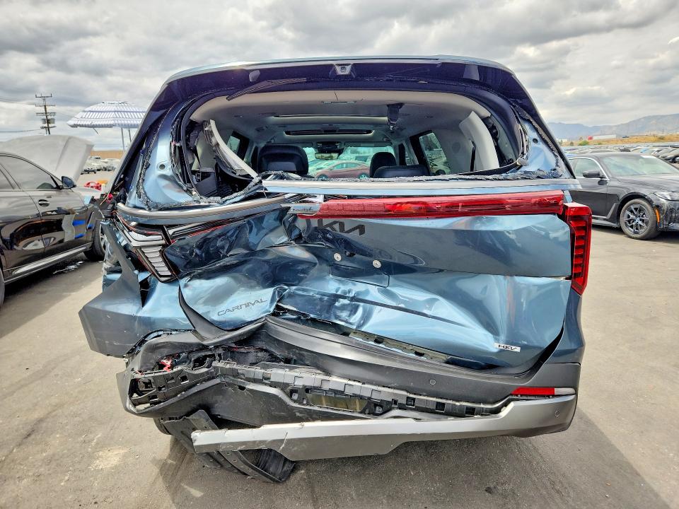 2026 Kia Carnival VIN KNDNE5KA1T6087399 COPART salvage auction — REAR END, Ca - Salvage Certificate, sold $12,400 on 2026-07-29 (photo 6)