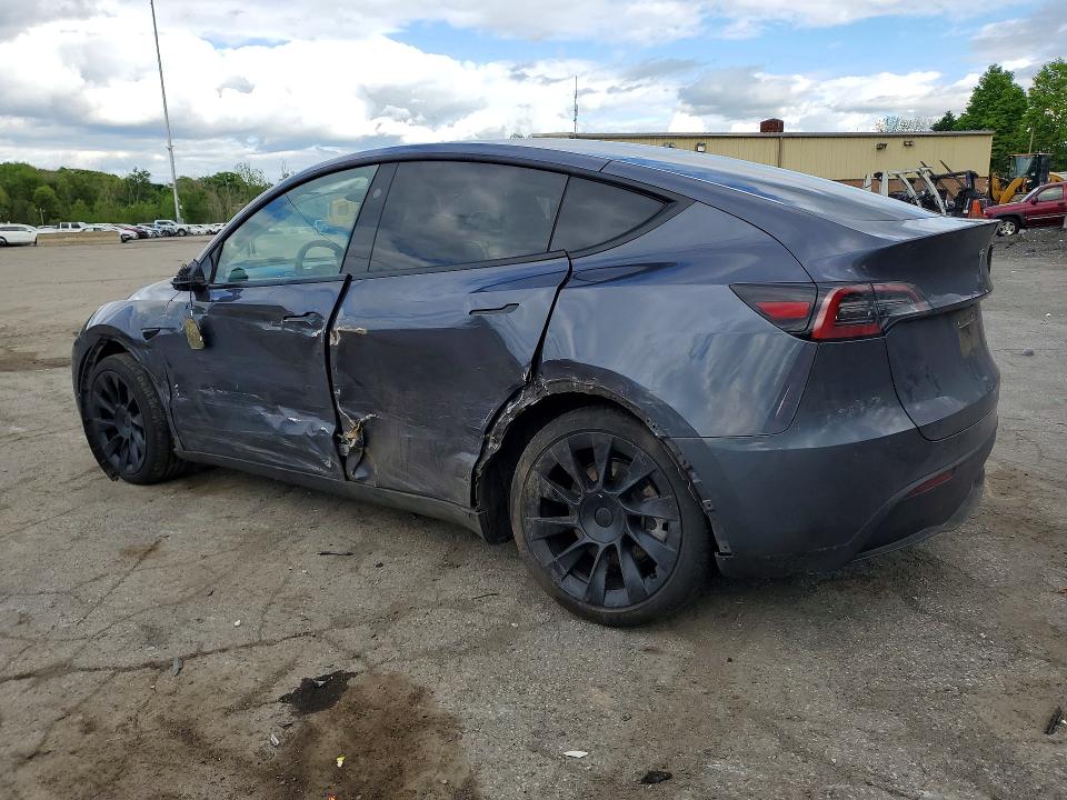 2023 Tesla Model y VIN 7SAYGDEE6PF868433 COPART salvage auction — SIDE, NY - MV-907A SALVAGE CERTIFICATE, sold $7,500 on 2026-07-28 (photo 2)