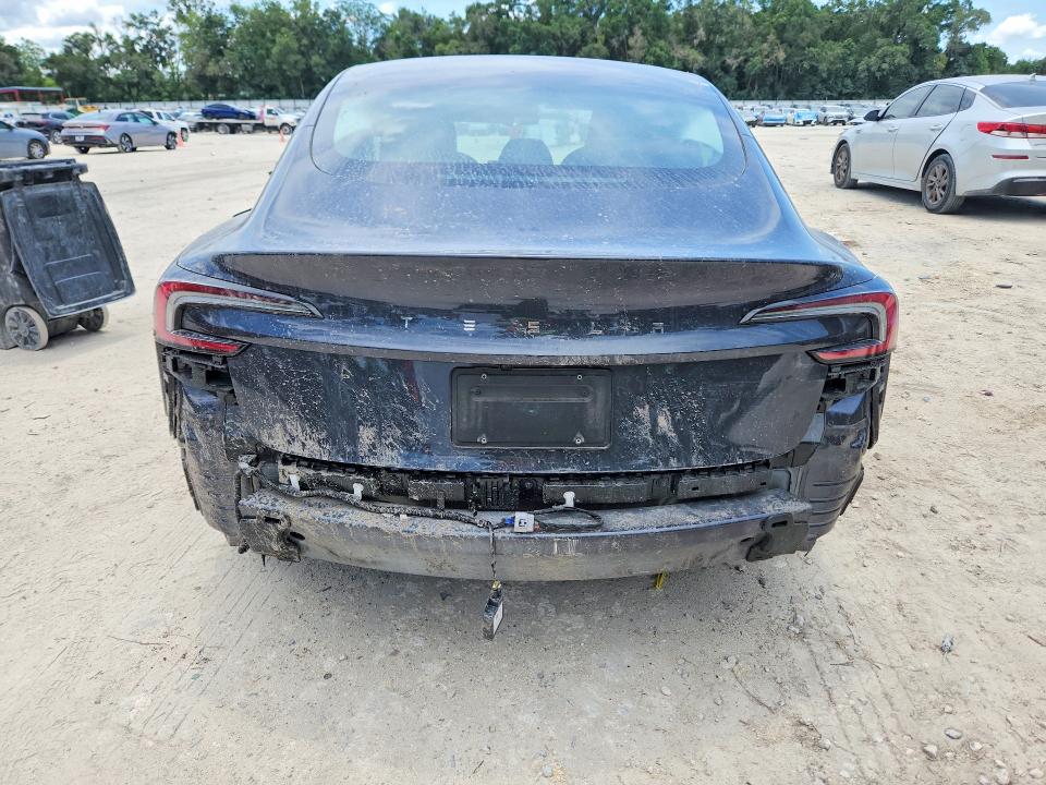 2025 Tesla Model 3 VIN 5YJ3E1EA5SF987947 COPART salvage auction — ROLLOVER, Fl - Cert Of Title Slvg Rebuildable, sold $9,200 on 2026-07-07 (photo 6)