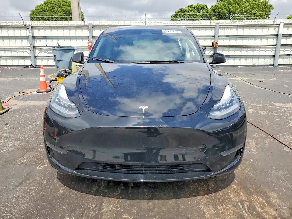 2023 Tesla Model y VIN 7SAYGDEE5PA078442 COPART salvage auction — SIDE, Fl - Cert Of Title Slvg Rebuildable, sold $11,900 on 2026-07-13 (photo 5)