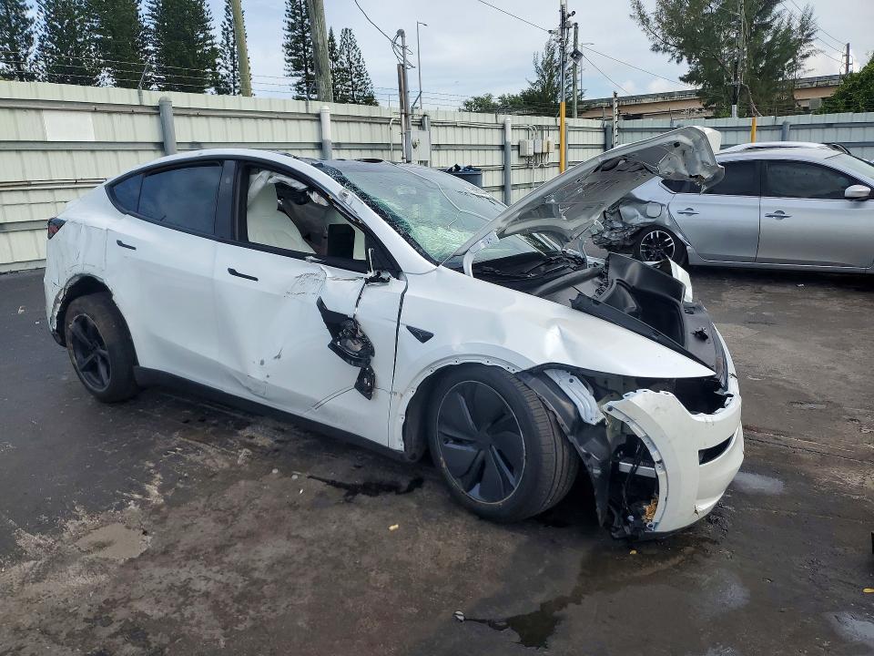 2026 Tesla Model y VIN 7SAYGDED6TA644142 COPART salvage auction — ALL OVER, Fl - Certificate Of Destruction, sold $300 on 2026-07-27 (photo 4)