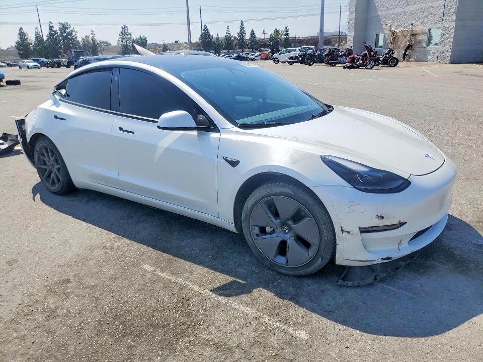 2023 Tesla Model 3 VIN 5YJ3E1EA0PF665515 COPART salvage auction — ALL OVER, CA - SALVAGE CERTIFICATE, sold $4,150 on 2026-07-16 (photo 4)
