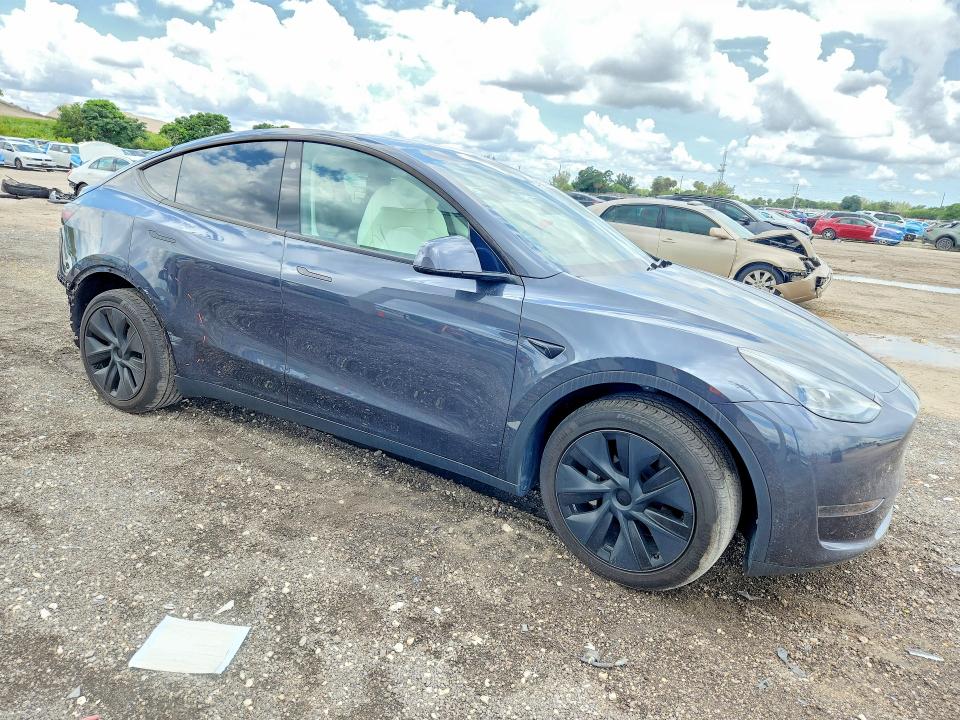 2024 Tesla Model y VIN 7SAYGDED7RA329696 COPART salvage auction — REAR END, Fl - Cert Of Title Slvg Rebuildable, sold $11,500 on 2026-07-23 (photo 4)