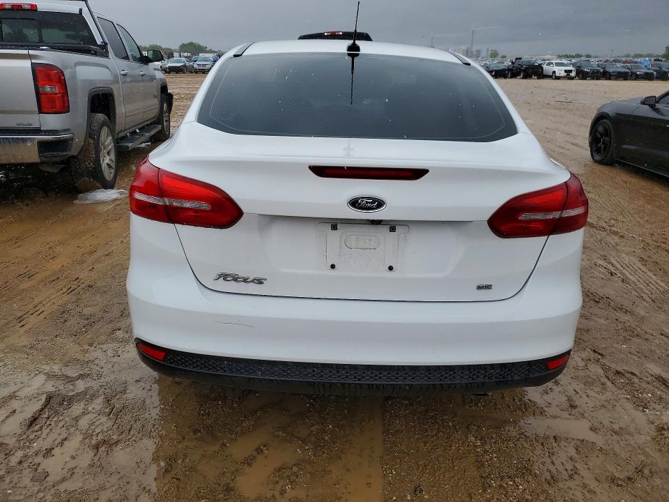 2017 Ford Focus VIN 1FADP3F27HL300674 COPART salvage auction — SIDE, Tx - Salvage Vehicle Title, sold $2,900 on 2026-07-02 (photo 6)