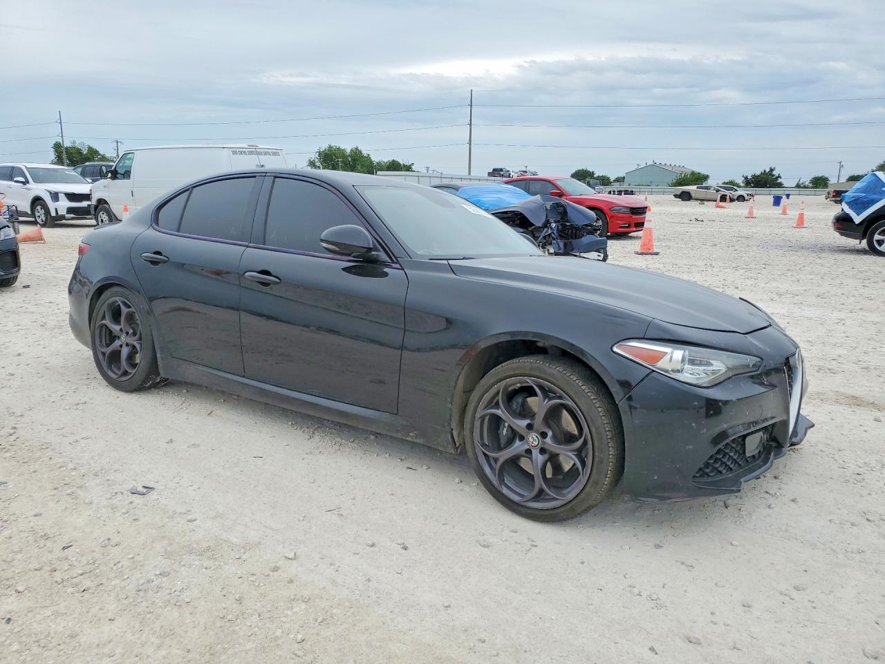 2018 Alfa Romeo Giulia VIN ZARFAECN8J7599479 COPART salvage auction — Side, TX - SALVAGE VEHICLE TITLE, sold $2,200 on 2026-07-09 (photo 4)
