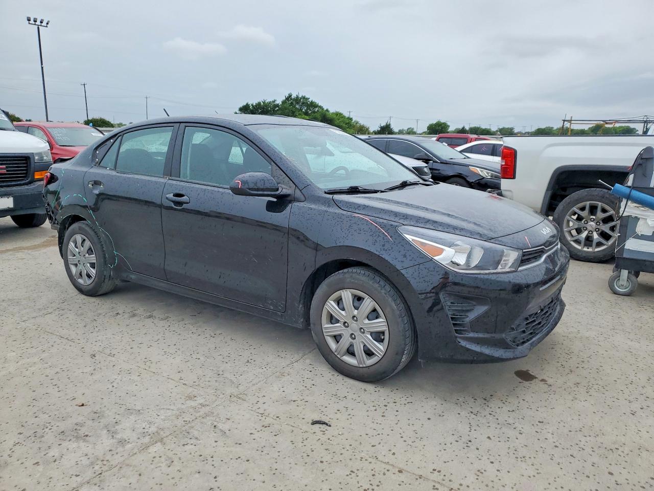 2023 Kia Rio VIN 3KPA24AD1PE598107 COPART salvage auction — Rear End, TX - SALVAGE VEHICLE TITLE, sold $4,400 on 2026-06-25 (photo 4)