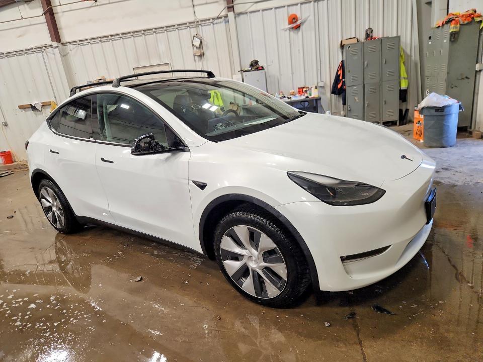 2023 Tesla VIN 7SAYGDEE9PF714007 COPART salvage auction — HAIL, Salvage Title, sold $12,000 on 2026-07-20 (photo 4)