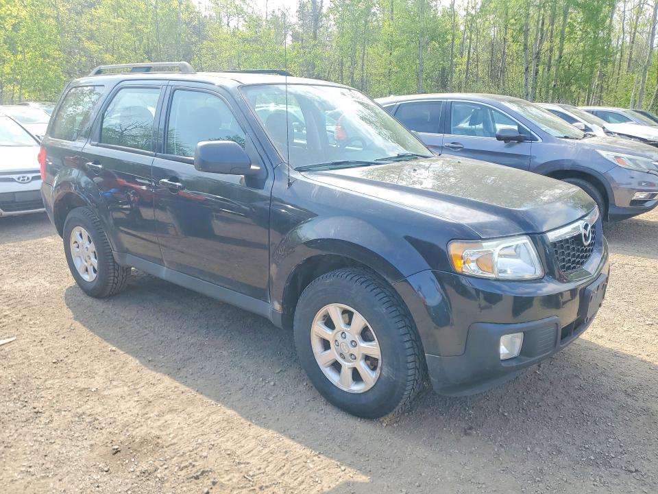 2011 Mazda Tribute VIN 4F2CY0C71BKM00946 COPART salvage auction — MINOR DENT/SCRATCHES, On - Permit No Brand - Unfit, sold $750 on 2026-07-03 (photo 4)