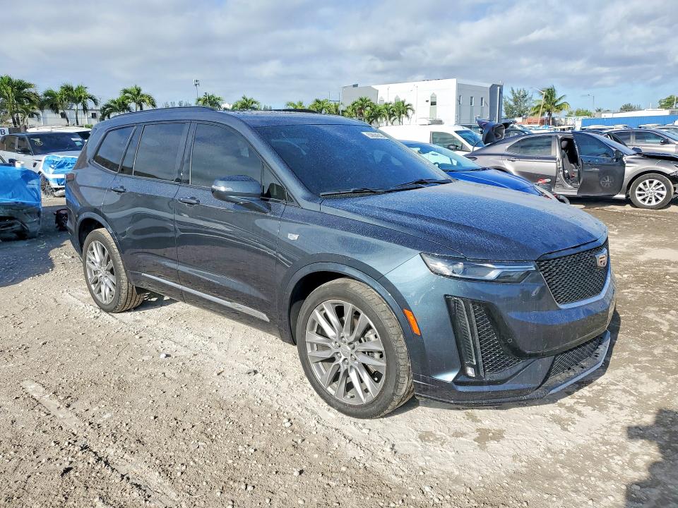 2021 Cadillac Xt6 VIN 1GYKPGRSXMZ156060 COPART salvage auction — WATER/FLOOD, FL - CERT OF TITLE SLVG REBUILDABLE, sold $11,100 on 2026-07-02 (photo 4)