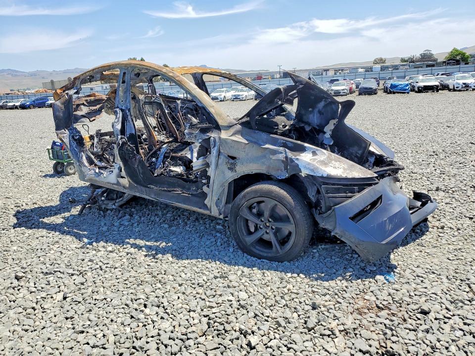 2026 Tesla Model y VIN 7SAYGDEE5TF341283 COPART salvage auction — BURN, Ca - Non-Repairable Vehicle Cert, sold $10 on 2026-07-16 (photo 4)