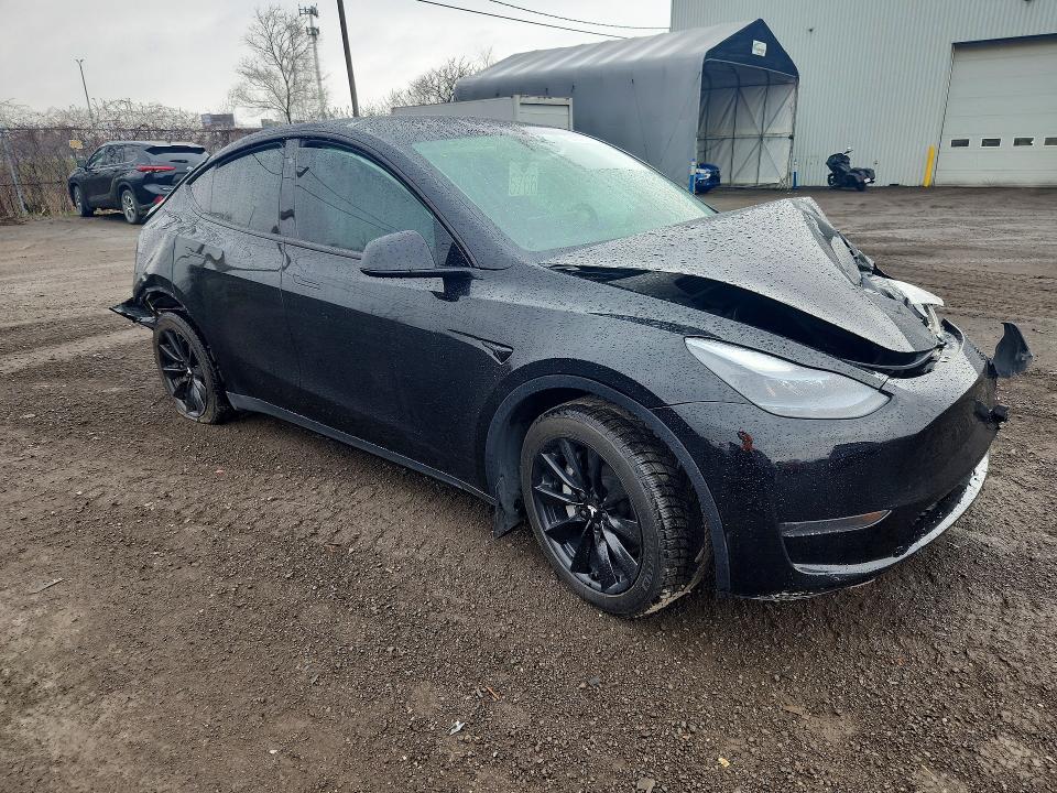 2023 Tesla Model y VIN LRWYGDFD4PC939125 COPART salvage auction — FRONT END, Qc - Gravement Accidente, sold $6,800 on 2026-07-07 (photo 4)