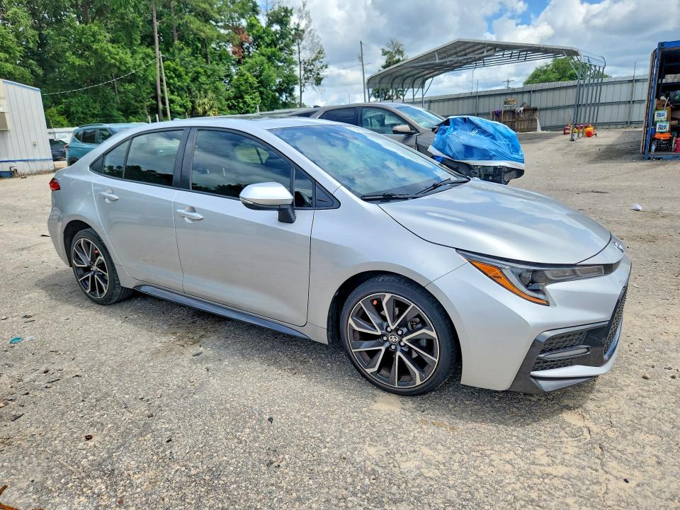 2022 Toyota Corolla VIN JTDP4MCE0NJ092410 COPART salvage auction — SIDE, Fl - Cert Of Title Slvg Rebuildable, sold $6,500 on 2026-07-10 (photo 4)