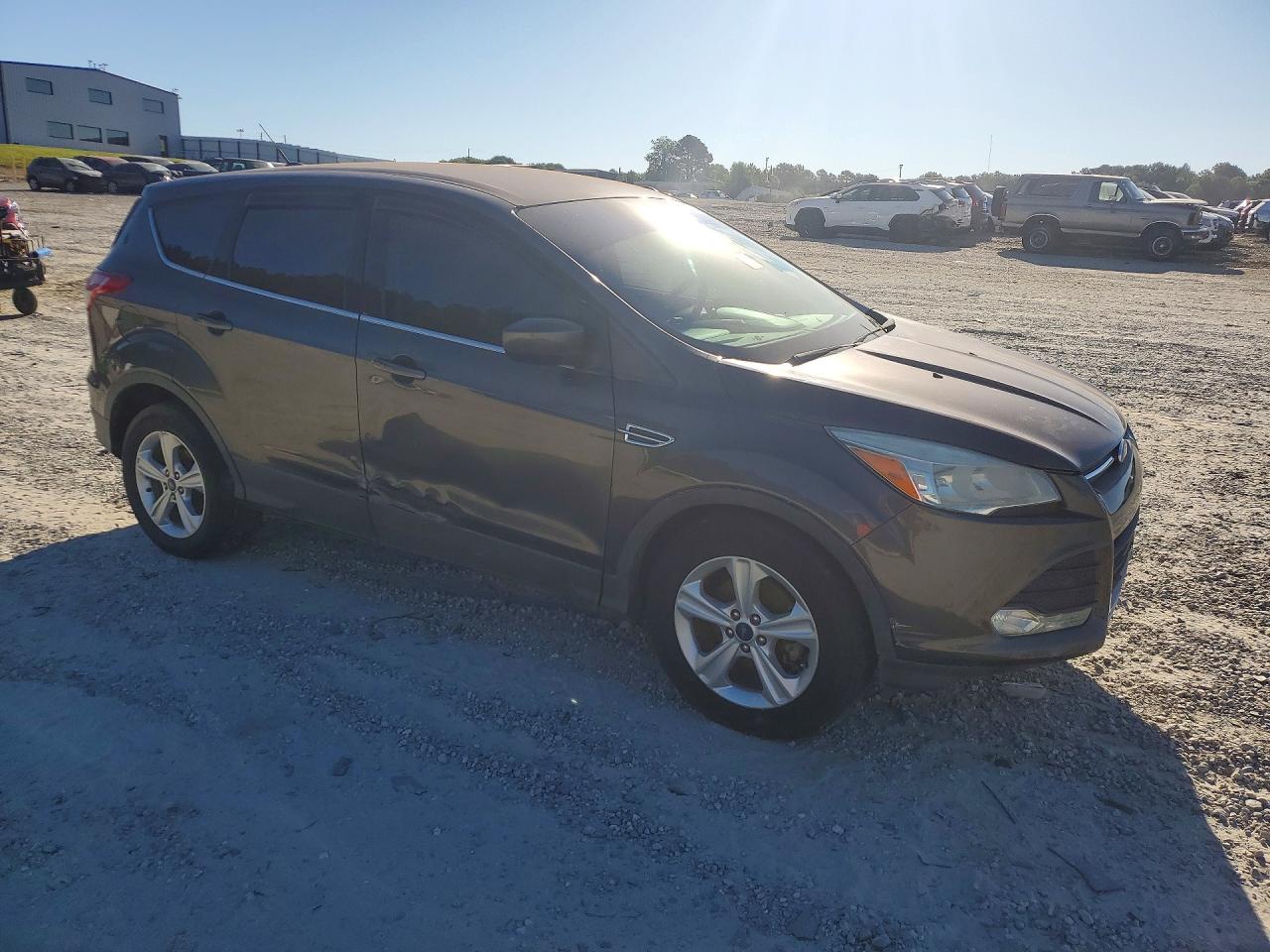 2015 Ford Escape VIN 1FMCU0GX3FUA98961 COPART salvage auction — Side, GA - CERT OF TITLE-COURT ORDER, sold $2,300 on 2026-07-06 (photo 4)