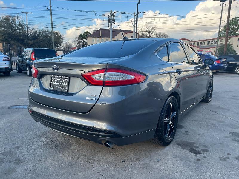 2013 Ford Fusion VIN 3FA6P0HR0DR200848 COPART salvage auction — NORMAL WEAR, Tx - Certificate Of Title (P), sold $4,000 on 2026-07-09 (photo 4)