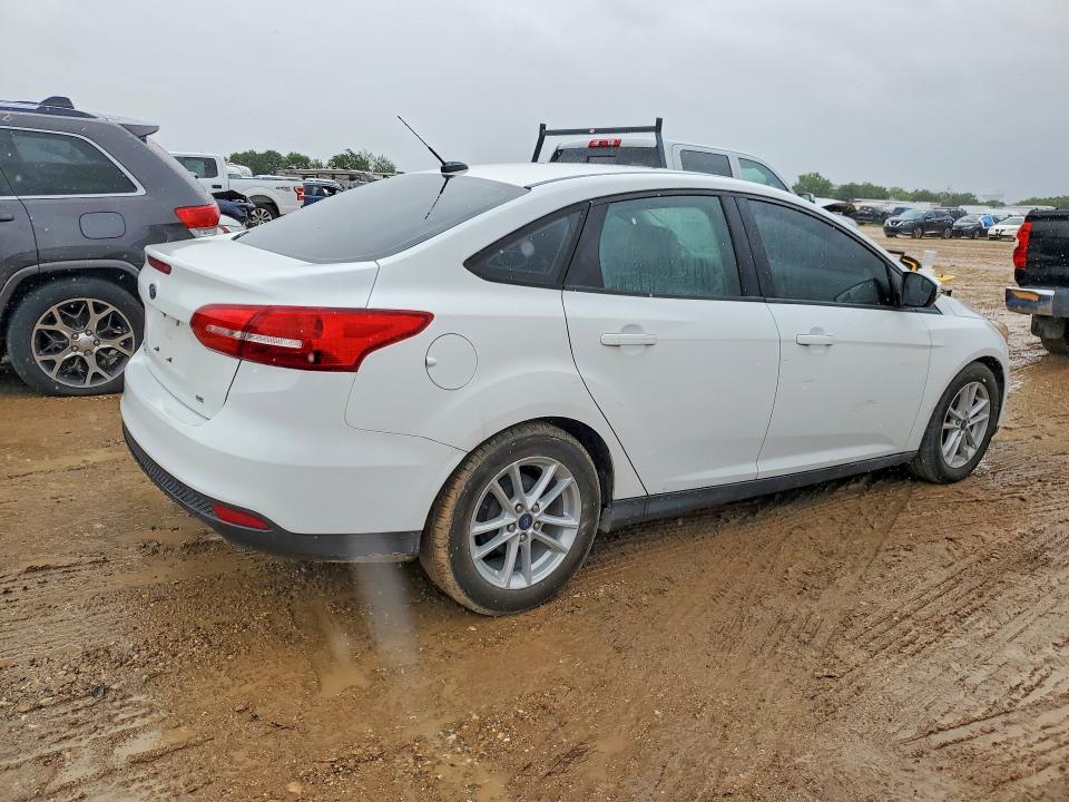 2017 Ford Focus VIN 1FADP3F27HL300674 COPART salvage auction — SIDE, Tx - Salvage Vehicle Title, sold $2,900 on 2026-07-02 (photo 3)