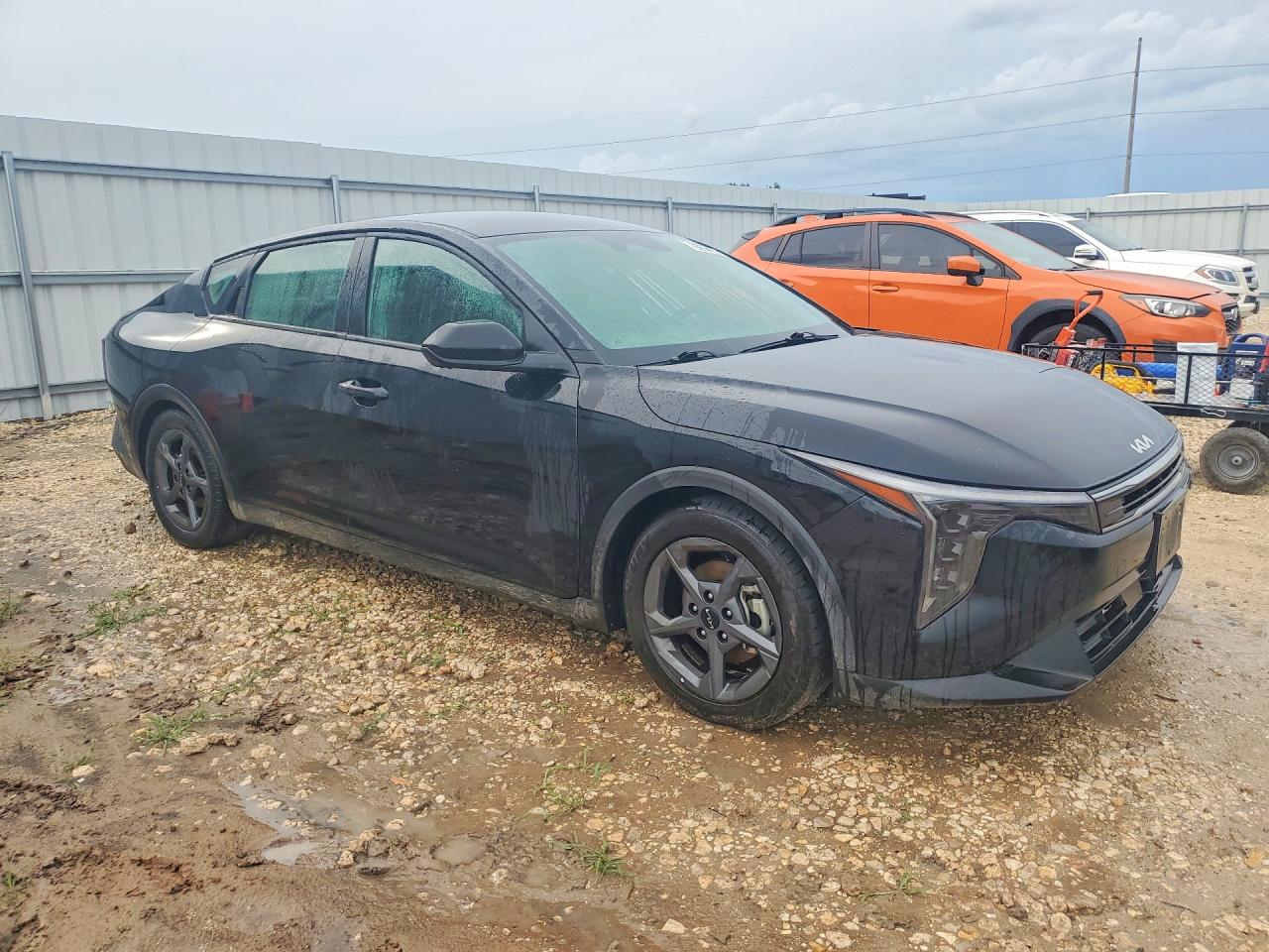 2025 Kia K4 VIN 3KPFT4DE1SE053542 COPART salvage auction — Water/Flood, TX - SALVAGE TITLE-FLOOD DAMAGE, sold $4,350 on 2026-07-09 (photo 4)