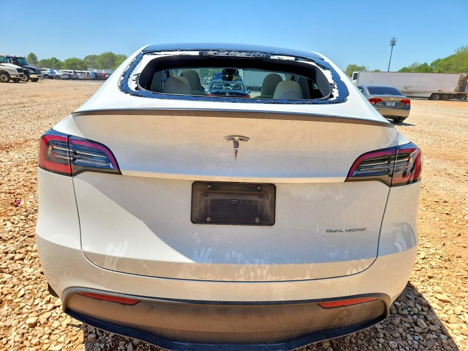 2024 Tesla Model y VIN 7SAYGDEE9RF160566 COPART salvage auction — HAIL, Salvage Title, sold $2,050 on 2026-07-29 (photo 6)