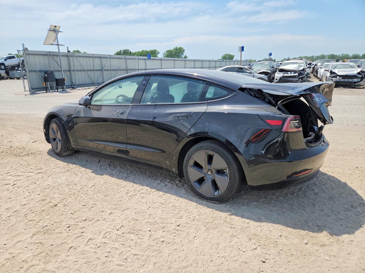 2022 Tesla Model 3 VIN 5YJ3E1EB2NF203544 COPART salvage auction — Side, KS - CERT OF TITLE-SALVAGE, sold $6,000 on 2026-07-09 (photo 2)