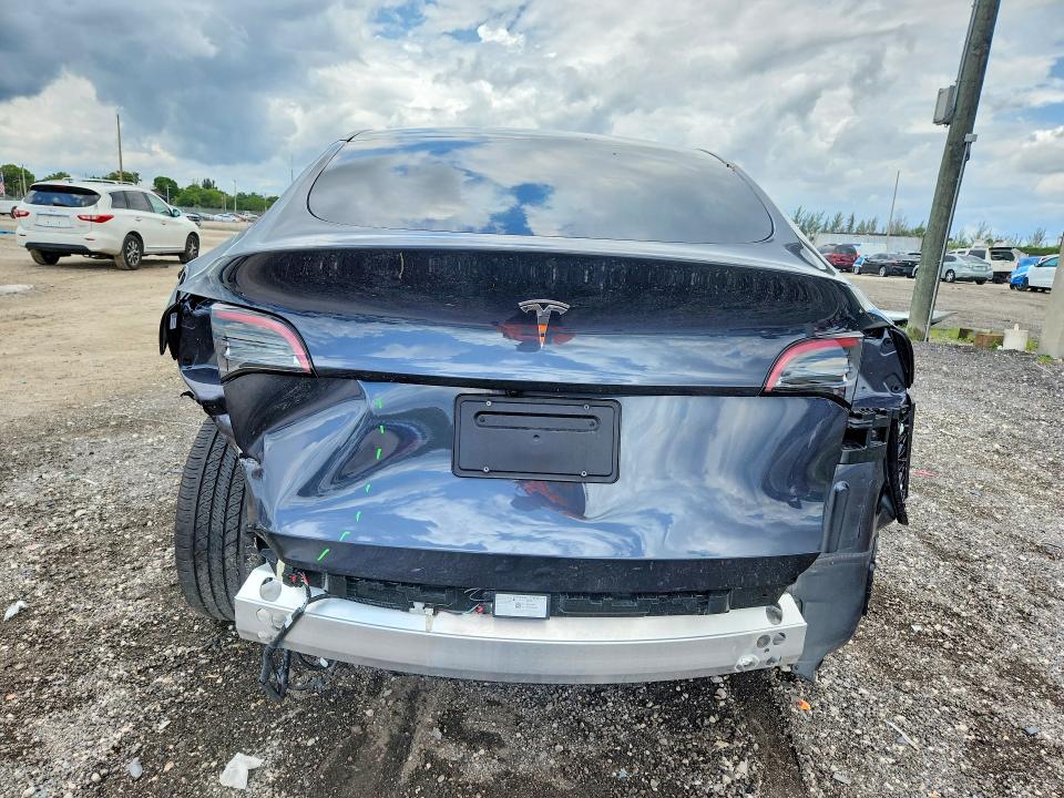 2024 Tesla Model y VIN 7SAYGDED7RA329696 COPART salvage auction — REAR END, Fl - Cert Of Title Slvg Rebuildable, sold $11,500 on 2026-07-23 (photo 6)