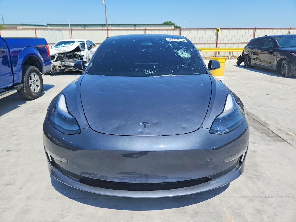 2023 Tesla Model 3 VIN 5YJ3E1EA2PF467924 COPART salvage auction — HAIL, Tx - Certificate Of Title, sold $1,150 on 2026-07-10 (photo 5)