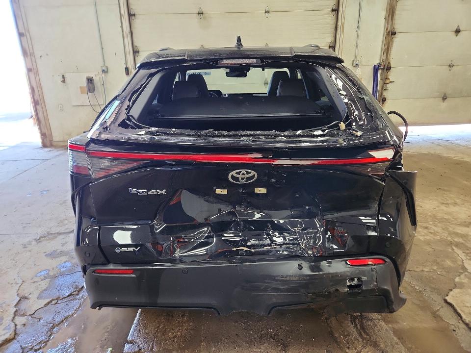 2024 Toyota Bz4x VIN JTMAAAAA7RA047693 COPART salvage auction — REAR END, MI - SCRAP CERTIFICATE OF TITLE, sold $8,400 on 2026-07-16 (photo 6)