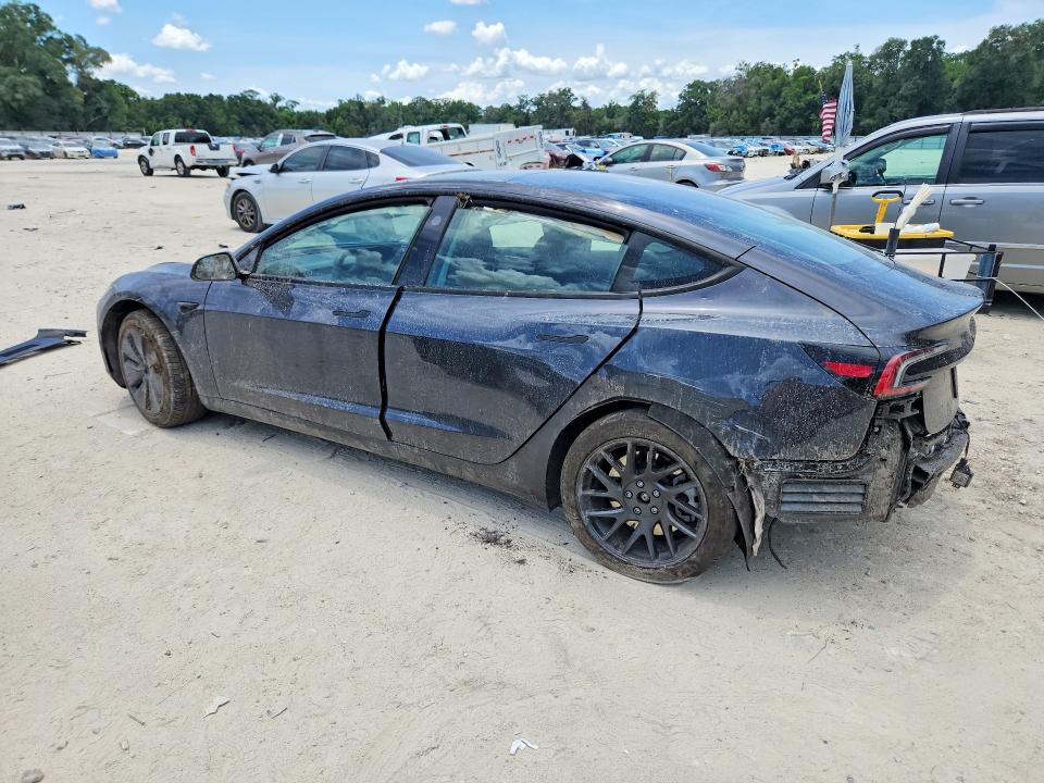 2025 Tesla Model 3 VIN 5YJ3E1EA5SF987947 COPART salvage auction — ROLLOVER, Fl - Cert Of Title Slvg Rebuildable, sold $9,200 on 2026-07-07 (photo 2)