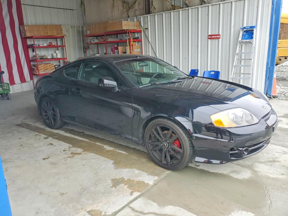 2004 Hyundai Tiburon VIN KMHHM65D04U107498 COPART salvage auction — SIDE, Nc - Salvage Certificate Of Title, sold $200 on 2026-07-08 (photo 4)