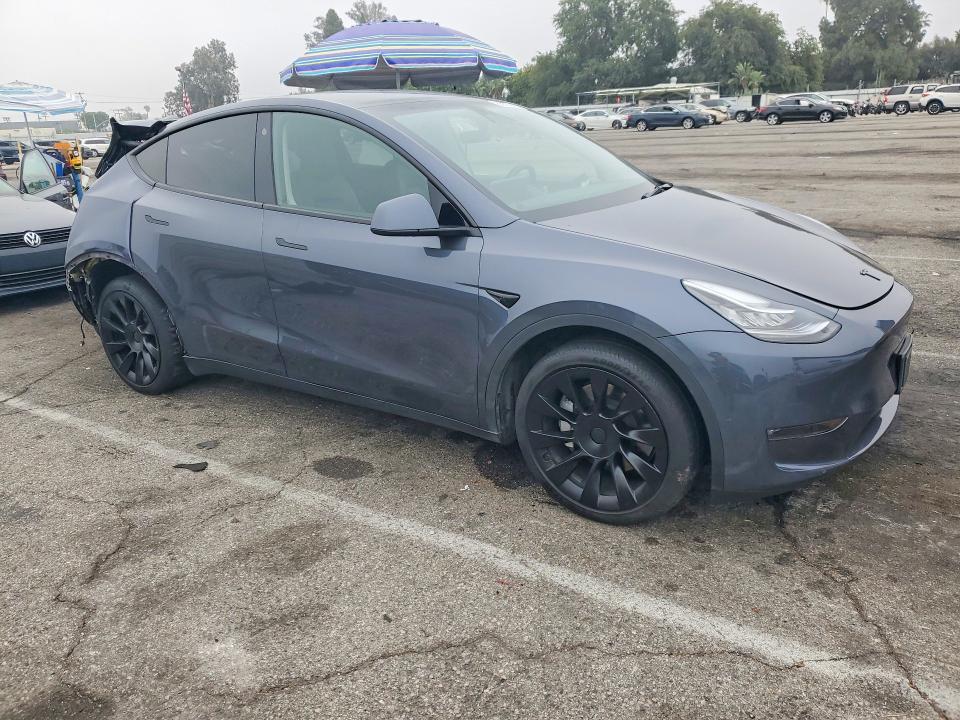 2023 Tesla Model y VIN 7SAYGDEE9PA113967 COPART salvage auction — REAR END, Ca - Salvage Certificate, sold $7,500 on 2026-07-17 (photo 4)