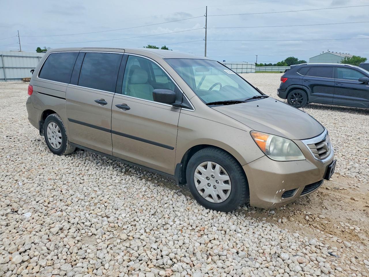 2010 Honda Odyssey VIN 5FNRL3H20AB001531 COPART salvage auction — Side, TX - SALVAGE VEHICLE TITLE, sold $400 on 2026-07-09 (photo 4)