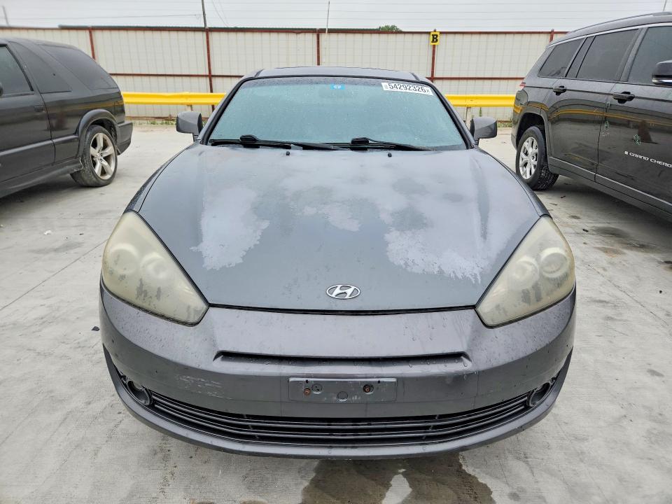 2007 Hyundai Tiburon VIN KMHHN66FX7U259922 COPART salvage auction — REAR END, TX - SALVAGE VEHICLE TITLE, sold $325 on 2026-07-31 (photo 5)