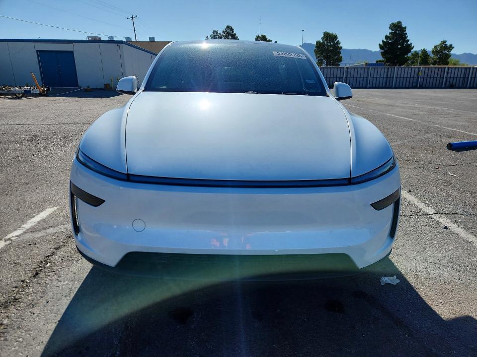 2026 Tesla Model y VIN 7SAYGDED8TA493353 COPART salvage auction — SIDE, Tx - Salvage Vehicle Title, sold $15,300 on 2026-07-31 (photo 5)