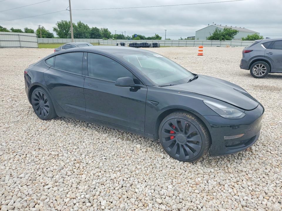 2022 Tesla VIN 5YJ3E1EC0NF293933 COPART salvage auction — SIDE, Tx - Salvage Vehicle Title, sold $10,000 on 2026-07-02 (photo 4)