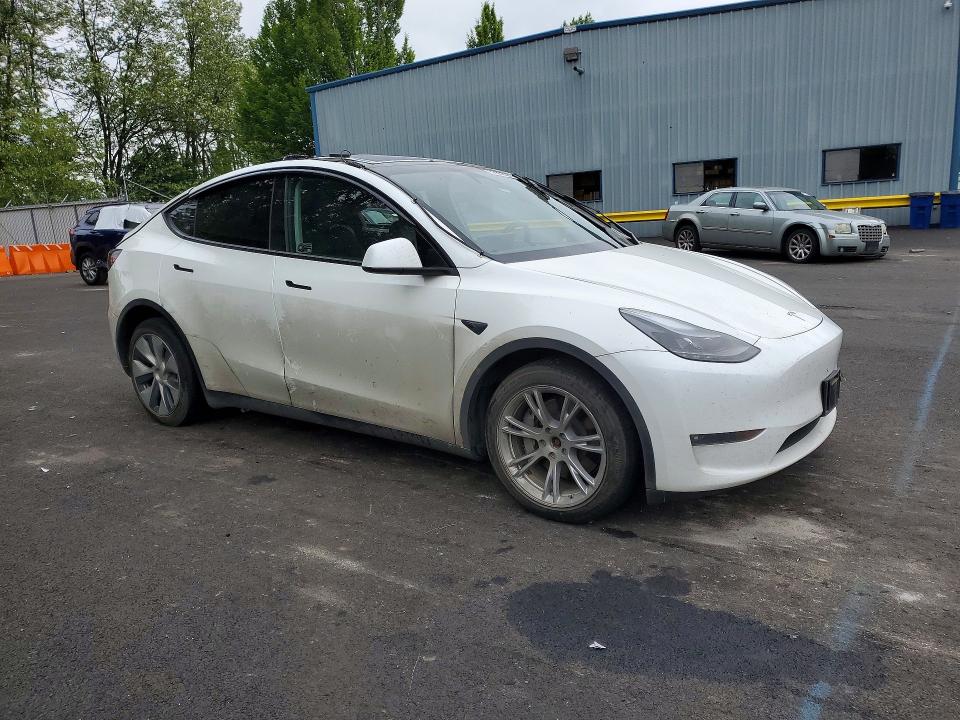 2023 Tesla Model y VIN 7SAYGDEE3PF909035 COPART salvage auction — SIDE, Or - Salvage Title Certificate, sold $8,000 on 2026-07-08 (photo 4)