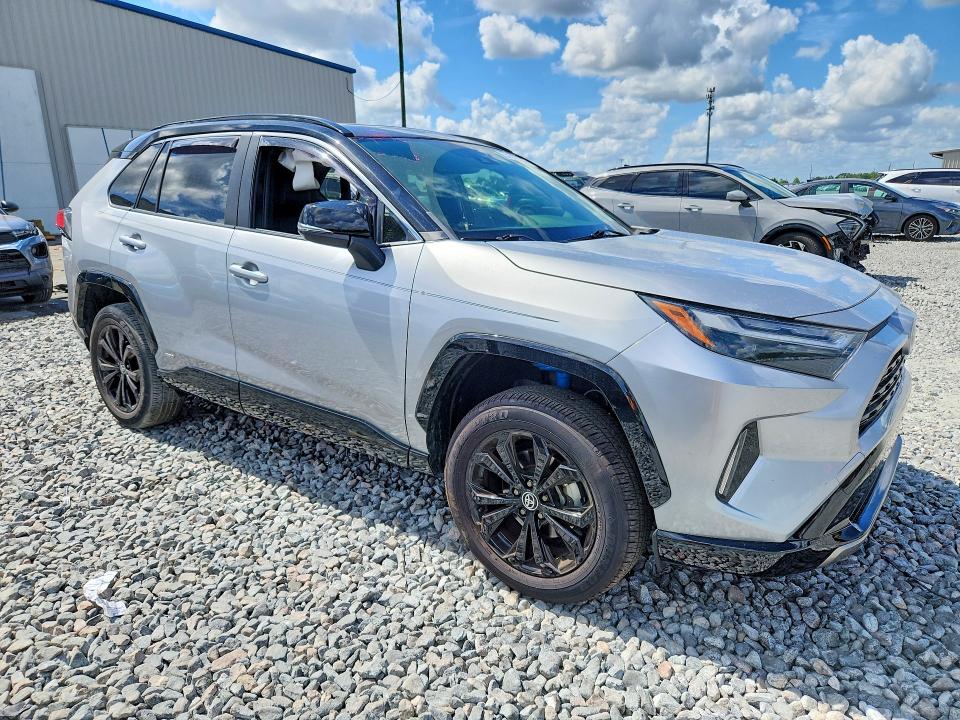 2023 Toyota Rav 4 VIN JTME6RFV6PJ031902 COPART salvage auction — SIDE, Fl - Cert Of Title Slvg Rebuildable, sold $13,500 on 2026-07-08 (photo 4)