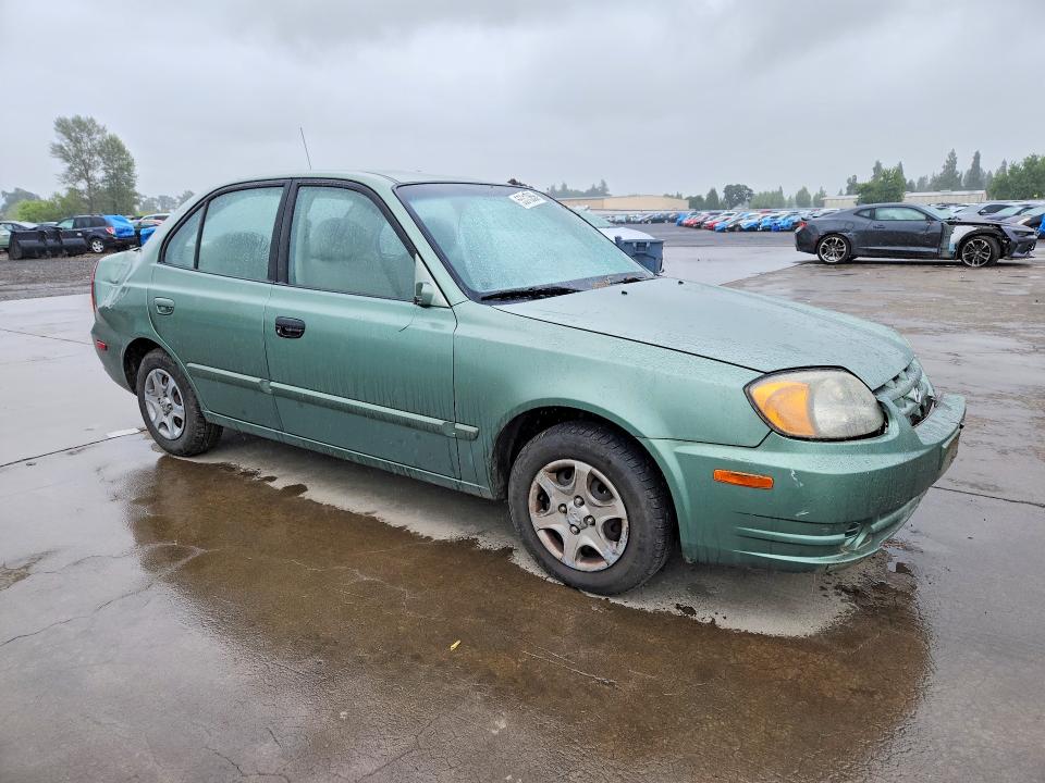2005 Hyundai Accent VIN KMHCG45C35U585400 COPART salvage auction — ROLLOVER, Or - Salvage Title Certificate, sold $150 on 2026-07-27 (photo 4)