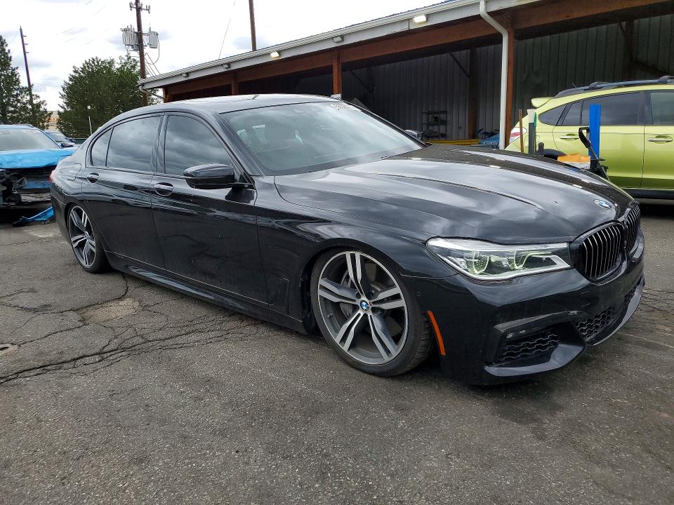 2017 BMW 7er VIN WBA7F0C32HGM21673 COPART salvage auction — SIDE, Co - Public - Salvage Title, sold $9,500 on 2026-07-07 (photo 4)