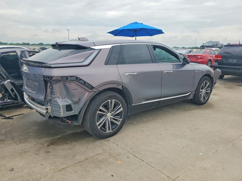 2024 Cadillac Lyriq VIN 1GYKPRRL4RZ131621 COPART salvage auction — SIDE, Tx - Salvage Vehicle Title, sold $16,600 on 2026-07-09 (photo 3)