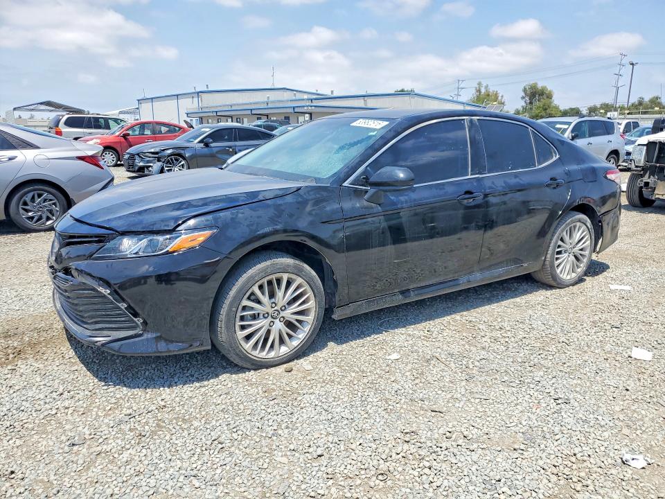 2019 Toyota Camry hybrid VIN 4T1B21HK7KU516393 COPART salvage auction — FRONT END, In - Dis/Dlr/Exp Only Clean Title, sold $10,800 on 2026-07-15 (photo 1)