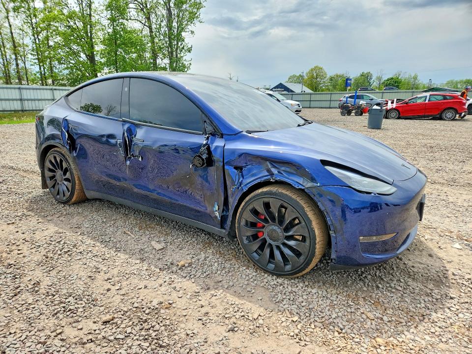 2023 Tesla Model y VIN 7SAYGDEF1PF856893 COPART salvage auction — SIDE, NY - MV-907A SALVAGE CERTIFICATE, sold $13,800 on 2026-07-06 (photo 4)