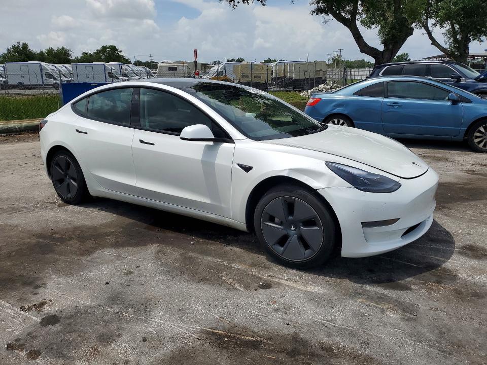 2023 Tesla Model 3 VIN 5YJ3E1EA6PF656060 COPART salvage auction — REAR END, Fl - Cert Of Title Slvg Rebuildable, sold $7,600 on 2026-07-14 (photo 4)