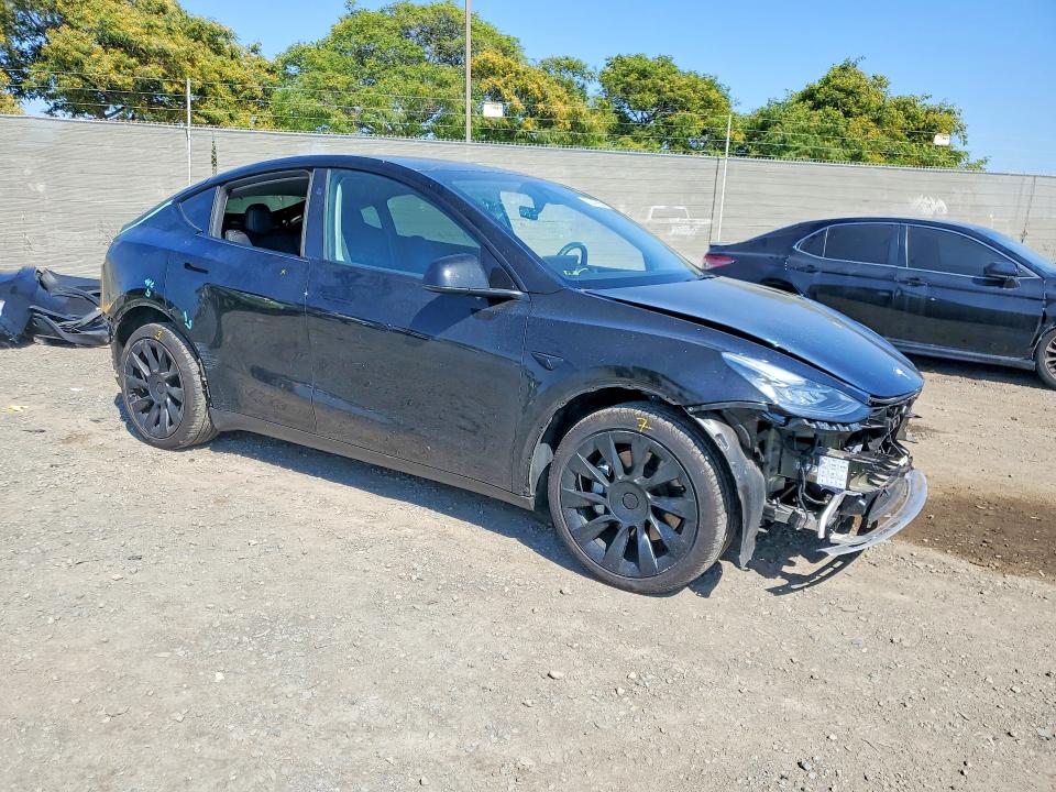 2023 Tesla Model y VIN 7SAYGDEE5PA147131 COPART salvage auction — REAR END, Ca - Salvage Certificate, sold $10,800 on 2026-07-28 (photo 4)