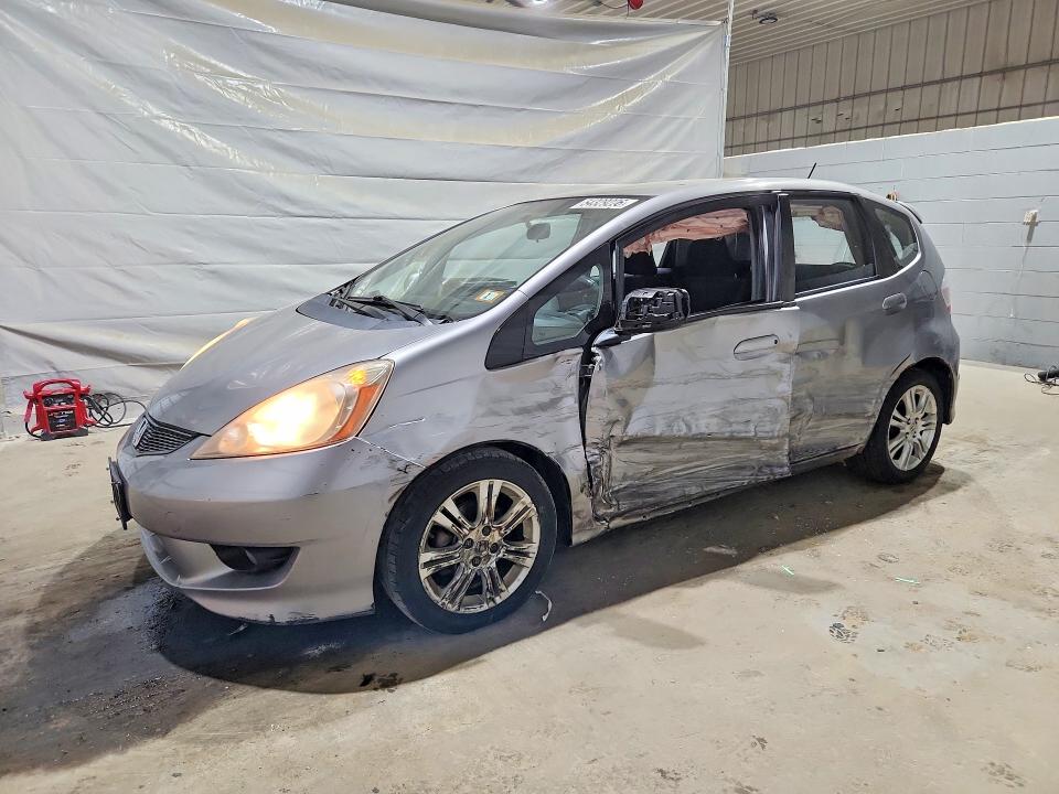 2009 Honda Fit VIN JHMGE88459S029435 COPART salvage auction — SIDE, Nh - Cert Of Title-Salvage, sold $100 on 2026-07-28 (photo 1)
