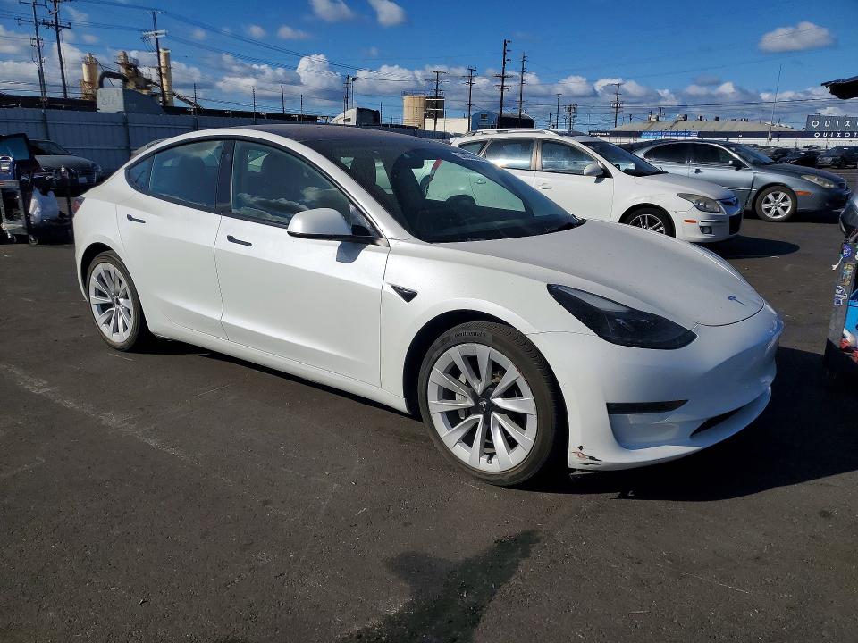 2022 Tesla Model 3 VIN 5YJ3E1EB8NF137548 COPART salvage auction — MINOR DENT/SCRATCHES, Ca - Salvage Certificate, sold $14,400 on 2026-07-06 (photo 4)