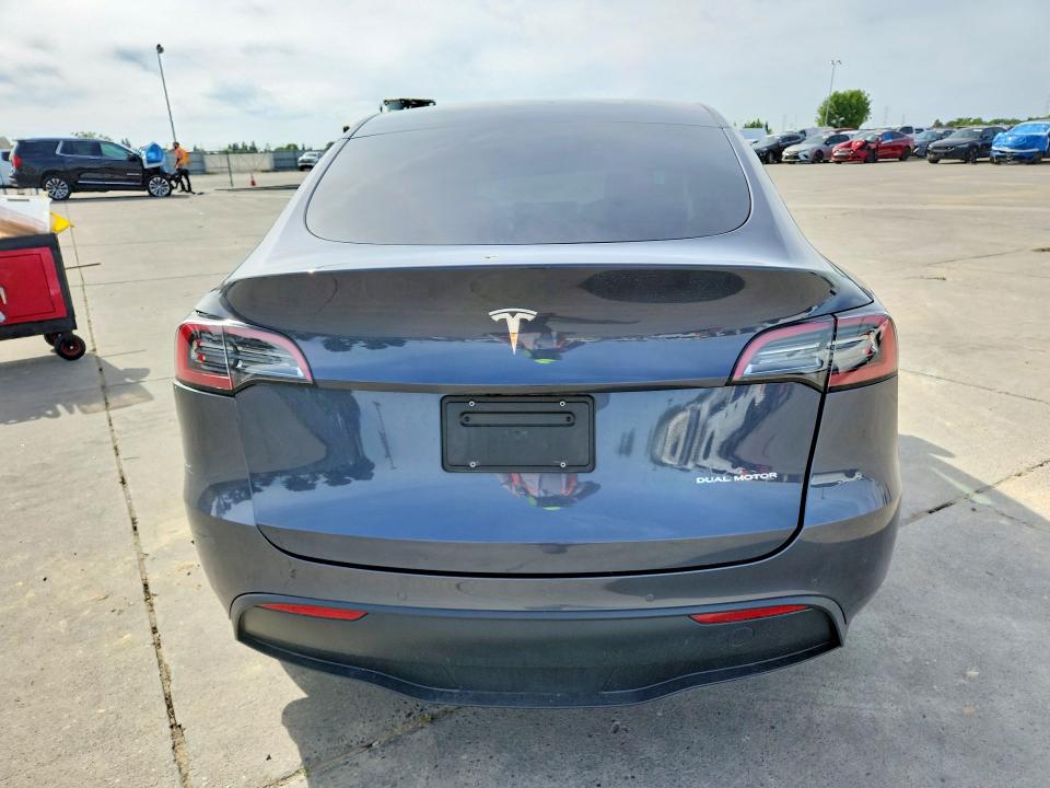 2022 Tesla Model y VIN 7SAYGDEE9NF569774 COPART salvage auction — REAR END, CA - SALVAGE CERTIFICATE, sold $11,400 on 2026-07-06 (photo 6)