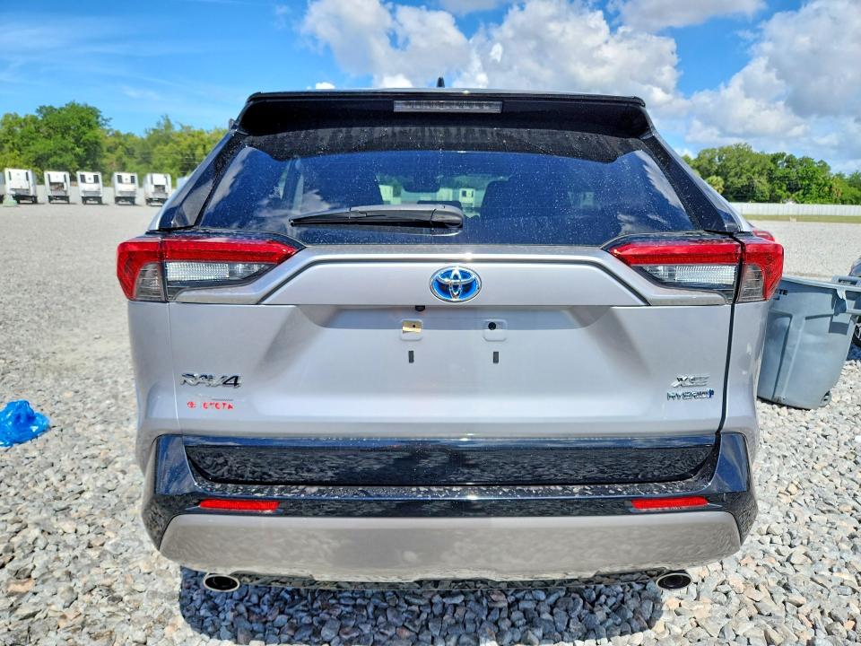 2023 Toyota Rav 4 VIN JTME6RFV6PJ031902 COPART salvage auction — SIDE, Fl - Cert Of Title Slvg Rebuildable, sold $13,500 on 2026-07-08 (photo 6)