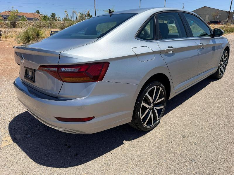 2019 Volkswagen Jetta VIN 3VWC57BU5KM241718 COPART salvage auction — MINOR DENT/SCRATCHES, Tx - Salvage Title-Flood Damage (P), sold $7,400 on 2026-07-06 (photo 4)