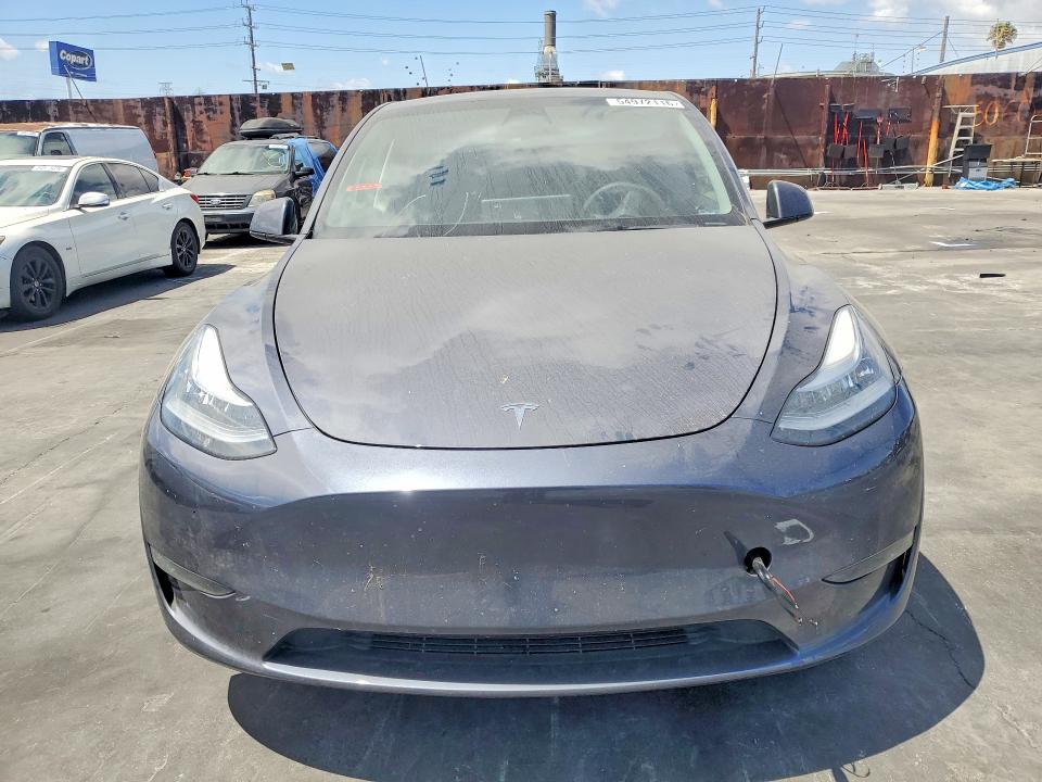 2023 Tesla Model y VIN 7SAYGDEE8PA113412 COPART salvage auction — MINOR DENT/SCRATCHES, Ca - Salvage Certificate, sold $14,100 on 2026-07-15 (photo 5)
