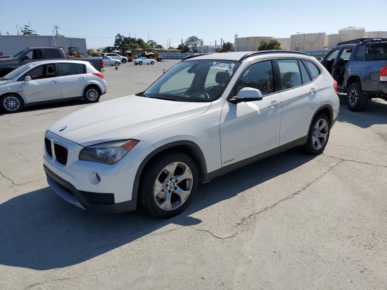 2014 BMW X1 VIN WBAVM1C51EVW49045 COPART salvage auction — MINOR DENT/SCRATCHES, Salvage Title, sold $0 on 2025-06-12 (photo 1)