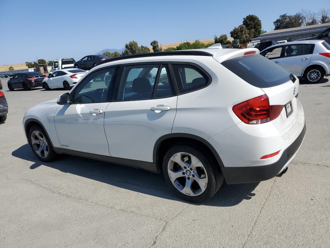 2014 BMW X1 VIN WBAVM1C51EVW49045 COPART salvage auction — MINOR DENT/SCRATCHES, Salvage Title, sold $0 on 2025-06-12 (photo 2)